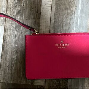 kate spade hot pink wristlet clutch with gold logo